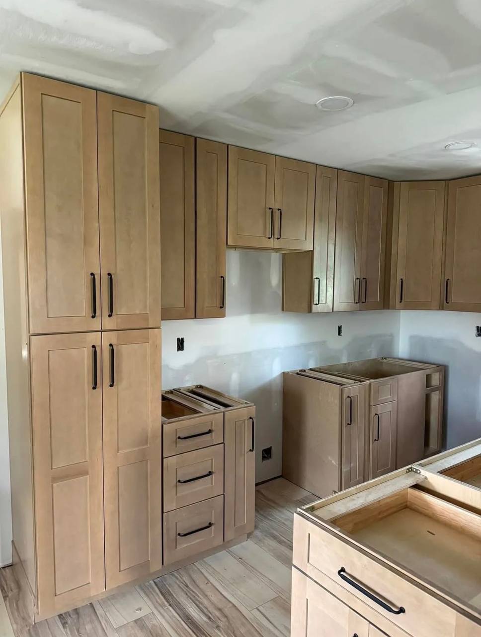 Tall and wall cabinets during installation.