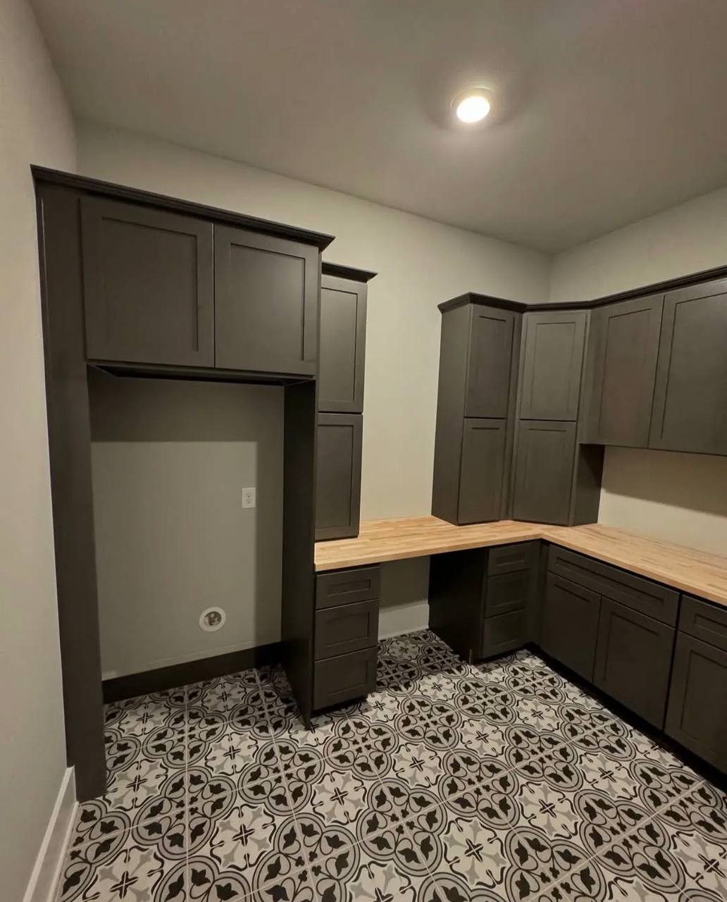 Another view of the laundry room cabinetry and counters.
