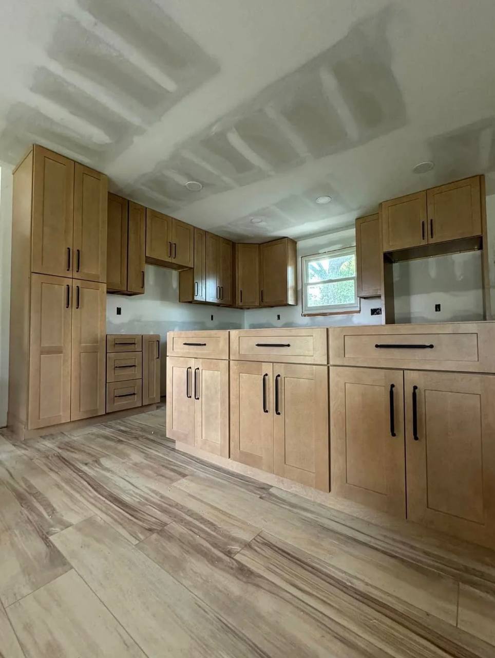 Island cabinetry and flooring during the kitchen renovation.